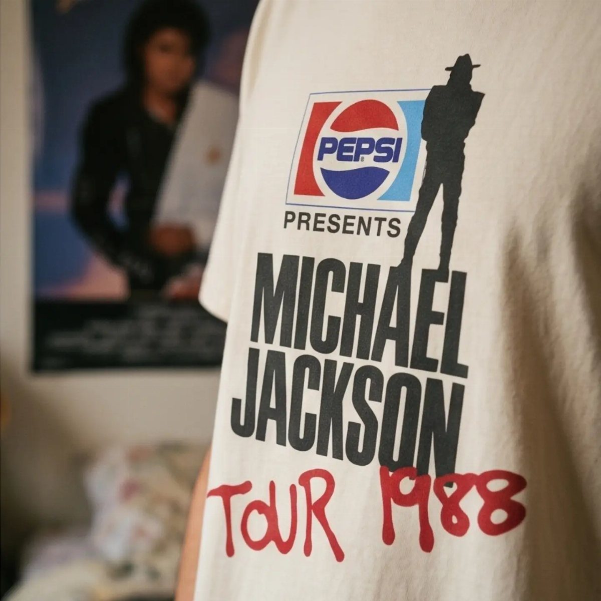 White graphic t-shirt featuring Michael Jackson Tour 1988 and Pepsi logo.