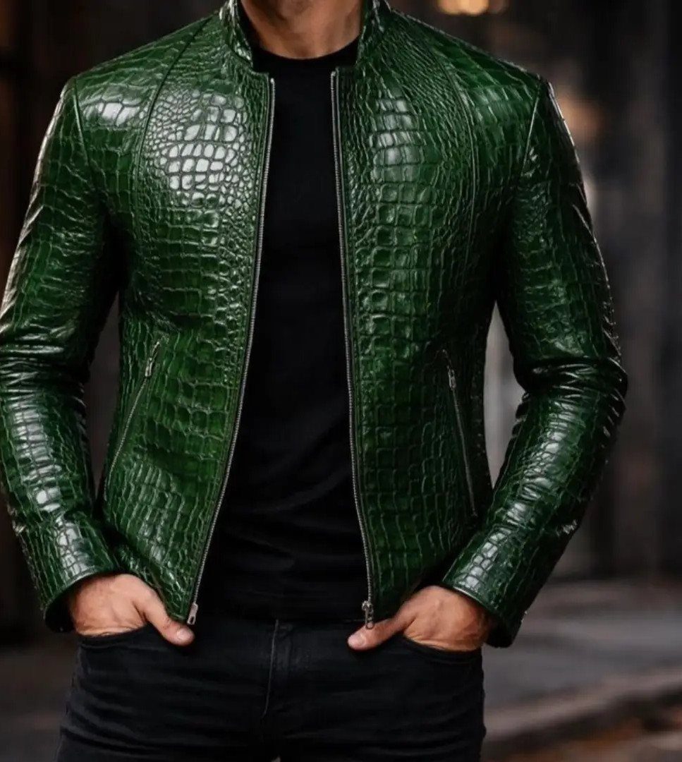 Man wearing a bright green crocodile print leather jacket and black clothing.