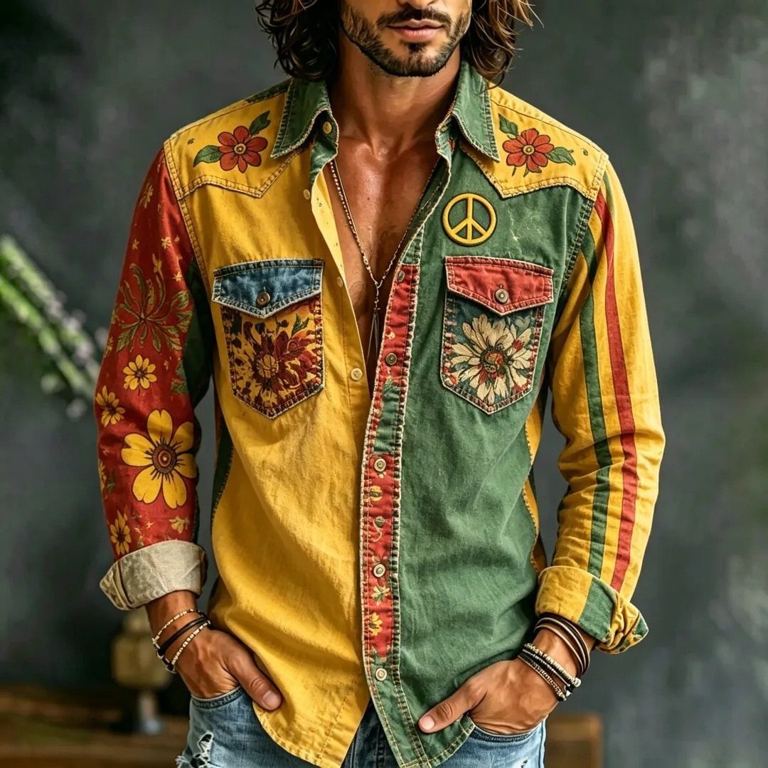 Man wearing a colorful hippie shirt with floral embroidery and a peace sign patch.