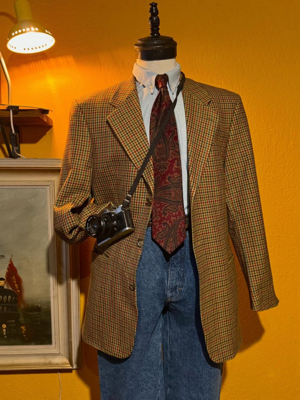 10 Images of 70's Men's Fashion from Flares to Fur Coats 9 Vintage 70s men's outfit with checkered blazer, wide red tie, and blue jeans.
