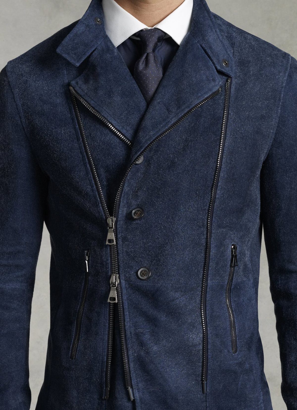 Navy blue suede leather jacket worn over a white shirt and dark tie.